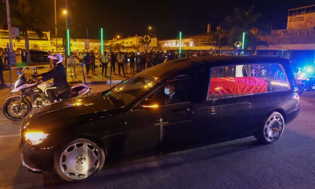 A hearse transports the body of José Eduardo dos Santos at Luanda airport.