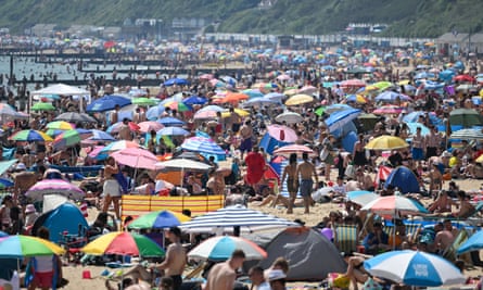 Crowds of people on the beach in Bournemouth