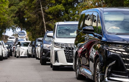 SUV cars in the car line up to collect children from Kambala school, Rose Bay, Sydney February 2025.