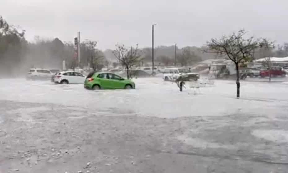Hail blankets the carpark at Tormina shopping centre in Coffs Harbour