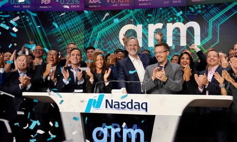 The Arm chief executive Rene Haas, middle, rings the opening bell at the Nasdaq in New York on Thursday.