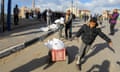 Palestinians carry away flour distributed by Unrwa in Rafah, Gaza, late last year.