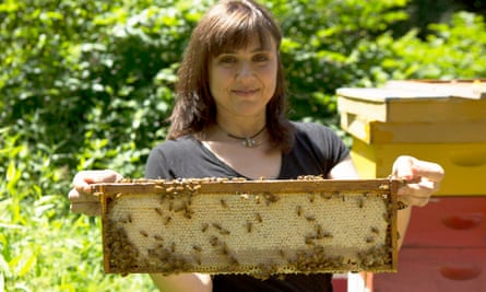 C Marina Marchese holding frames of honey