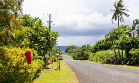 Red flags are seen hanging outside of homes of Apia residents indicating they have not been vaccinated for measles