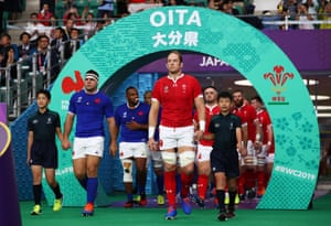 Guilhem Guirado of France and Alun Wyn Jones of Wales lead the teams out.