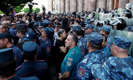 Armenian police guard Government House in Yerevan as people stage anti-government protests