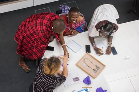 Diplomacy … Samwell Nangiria, second right, and fellow Maasai explain an object’s significance to curators.