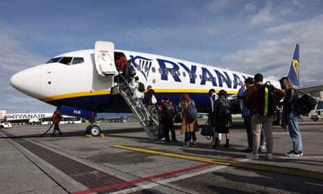Passengers board a Ryanair airplane in Orio al Serio near Bergamo, Italy
