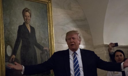 A place in history: Donald Trump greets White House visitors while standing in front of an official portrait of Hillary Clinton.