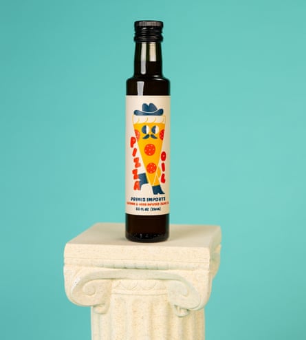 A vessel of Primis Pizza Oil connected a bluish background