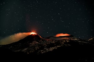 A night view of the south-east crater complex and the intra-crater of the Bocca Nuova and Voragine crater complexes during explosive activity