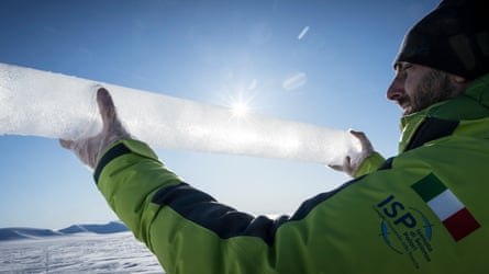 Man holding up an ice core