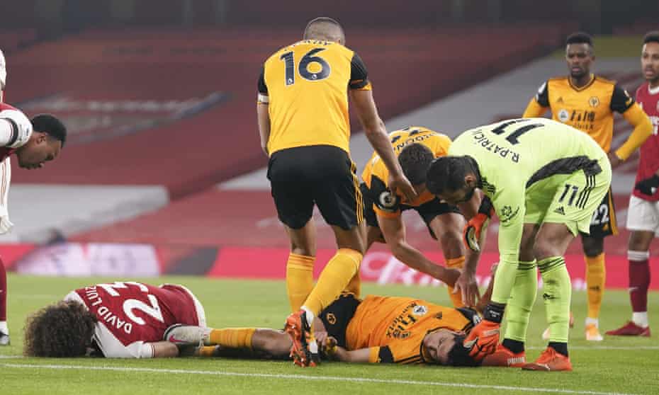 Arsenal’s David Luiz and Wolves’ Raúl Jiménez after their clash of heads