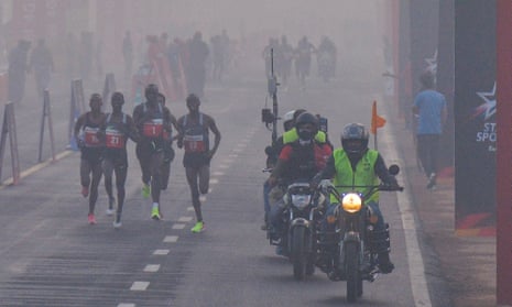 Participants make their way along Rajpath during the Delhi half marathon