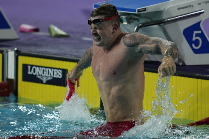 Adam Peaty of England celebrates.
