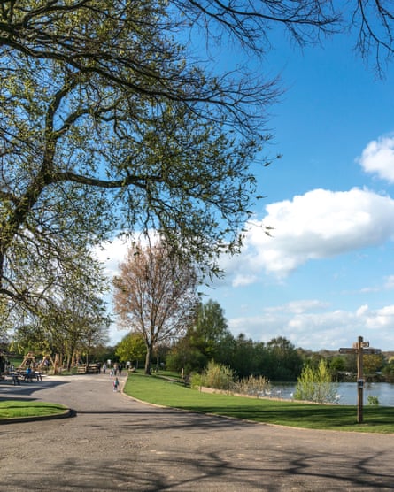 A lake and playground facilities at Ferry Meadows Country Park, in Nene Park.