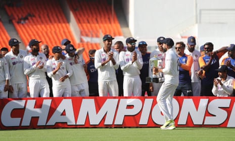 Virat Kohli and his India teammates celebrate after their victory over England.
