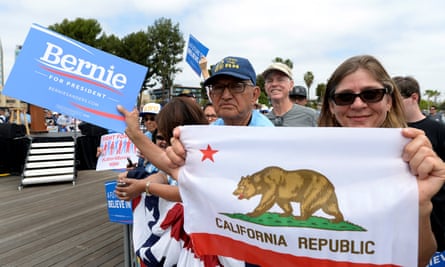 Bernie Sanders wait for their candidate to arrive for a campaign event in San Pedro, California, on Friday.