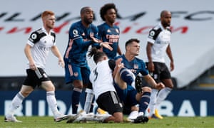 Arsenal’s Granit Xhaka is tackled by Fulham’s Michael Hector as Arsenal’s Alexandre Lacazette appeals to the referee.