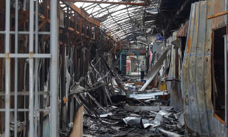 Russia-Ukraine war latest: fierce fighting in Sievierodonetsk; UK ‘deeply concerned’ by death sentences for Britons in Donetsk – live | World news 4 A local resident stands next to debris of an open market destroyed by a military strike in Sievierodonetsk on 16 April 2022.