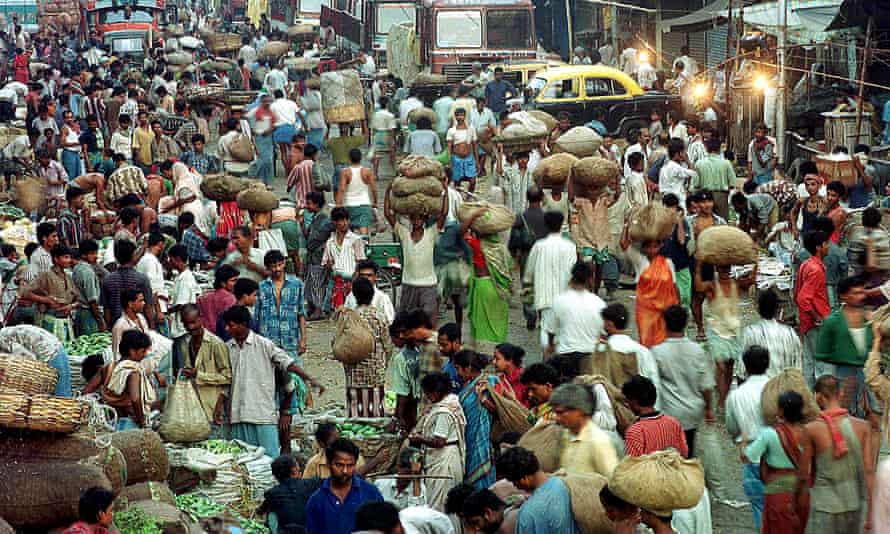 People make their way through a crowded market in Calcutta.