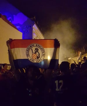 A Melbourne Knights flag is held aloft during Croatian World Cup celebrations in Zagreb.