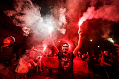 Moroccans celebrate their team's victory in Rabat.