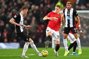 Manchester United’s Scott McTominay receives a yellow card for this challenge on Newcastle United’s Sean Longstaff.