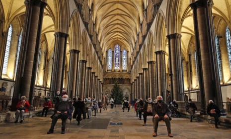 People sitting in Salisbury cathedral today, after after receiving a dose of a Covid-19 vaccine at the vaccination centre set up in the building.