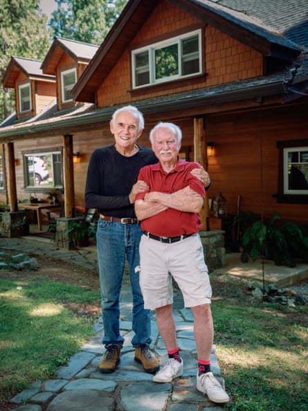 Brothers Scott (right, in black jumper) and Bruce (left, in red shirt), standing outside a house, July 2025