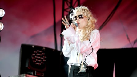 Grimes successful achromatic garment and sunglasses performing astatine Coachella
