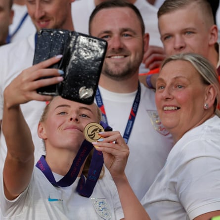 England winning goalscorer Chloe Kelly has a selfie with her family and her winners medal .
