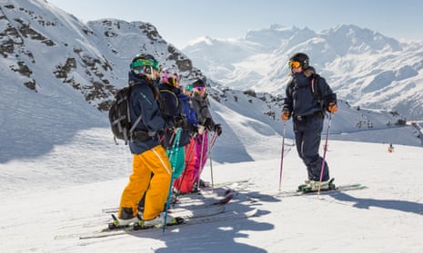 Women line up at the top of a run at a ski camp, Verbier, France.