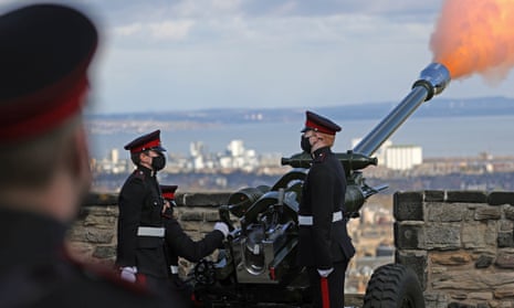 A handout photo made available by the British Ministry of Defense shows a gun salute at Edinburgh Castle