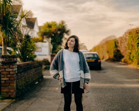 Paula on the pavement of a residential street