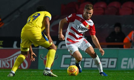 Herbie Kane, here taking on AFC Wimbledon, has scored four goals in his past four games for Doncaster, on loan from Liverpool.
