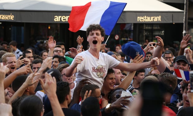 French supporters celebrate in Paris, on July 6, 2018, after France defeated Uruguay to win the quarter-final of the Russia 2018 World Cup.