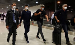 Serbian tennis player Novak Djokovic walks through Melbourne Airport before boarding a flight to Dubai.
