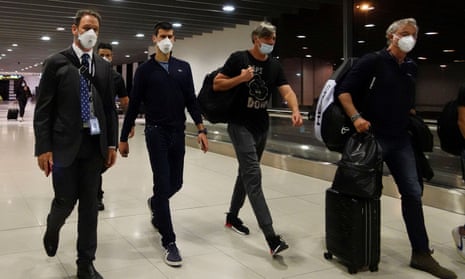 Novak Djokovic walks in Melbourne Airport prior to boarding his flight out of Australia