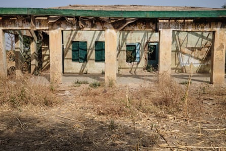 A boarded-up and damaged building
