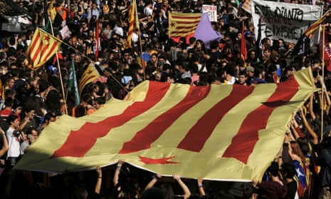 Students carry a Catalan pro-independence flag during a demonstration in Barcelona, 26 October, 2017. 