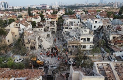 Israeli rescue teams at the site where Iranian ballistic missiles hit residential buildings in Rishon LeZion, near Tel Aviv, Israel, 14 June 2025.