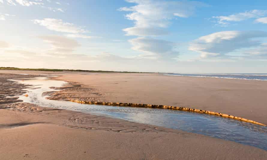 Tide ebbing on an empty beach at Gibraltar Point, Lincolnshire