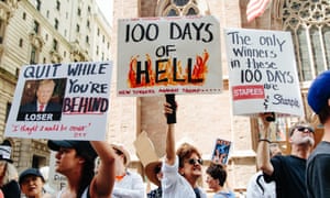 People protest outside Trump Tower on Fifth Avenue during the ‘100 Days of Failure’ protest in New York, New York, on Saturday.