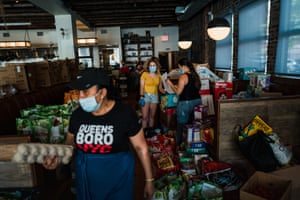 Volunteers for the COVID Care Neighborhood Network pack meals at the Queensboro restaurant in Jackson Heights. Led by community organizer, Nuala O’Doherty Naranjo (not pictured), the organization packs and delivers food to nearly 600 families every week in the neighborhoods of Corona, Jackson Heights, Woodside and Elmhurst.