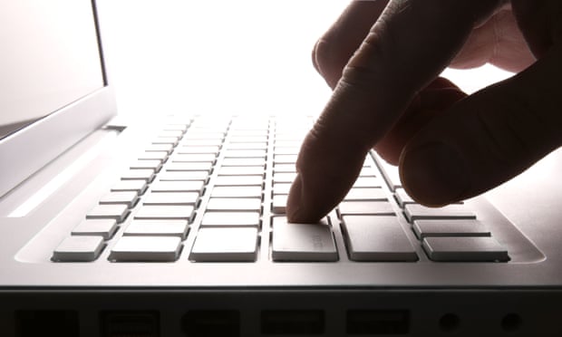 Man pressed key on white laptop in backlit Close up scene<br>B8E635 Man pressed key on white laptop in backlit Close up scene