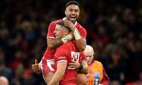 Wales’ Rhys Priestland (bottom) is congratulated by team-mate Uilisi Halaholo after scoring the winning penalty.