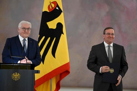 German president Frank-Walter Steinmeier (L) hands over the certificate of appointment to Germany's new defence minister Boris Pistorius at the presidential Bellevue Palace in Berlin.