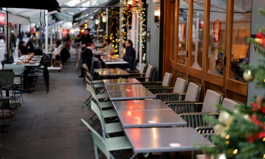 Empty tables outside a restaurant in central London on Tuesday