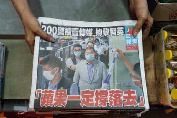 A bundle of newspapers are put on a counter